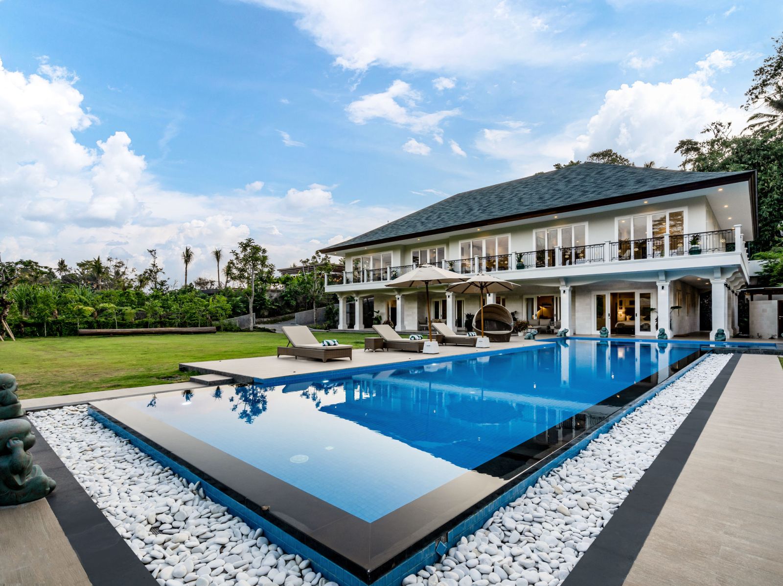 001 pala ubud villa agung expansive lap pool by the lawn