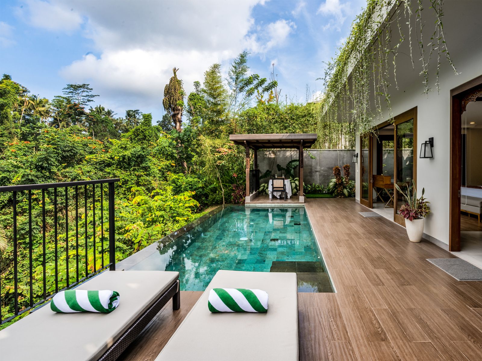 11 pala ubud villa catur relaxing pool deck by the riverside