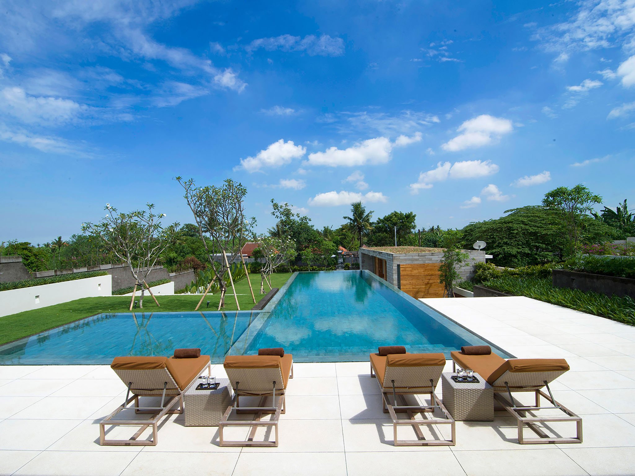 2. the iman villa sunloungers by the pool